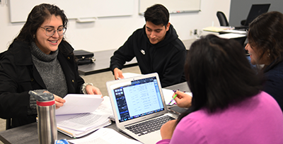 WSOB students around a computer